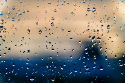 Full frame shot of wet glass window