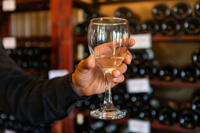 Close-up of hand holding wineglass