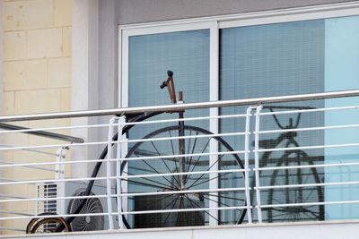 Close-up of railing with bike