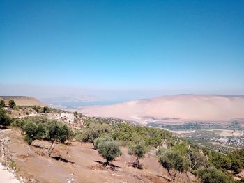 High angle view of landscape against blue sky