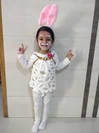 Portrait of smiling girl standing on floor