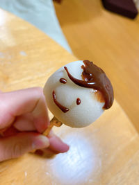 Close-up of hand holding ice cream