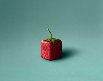 Close-up of strawberry against blue background