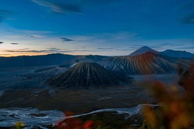 View of volcanic landscape against cloudy sky