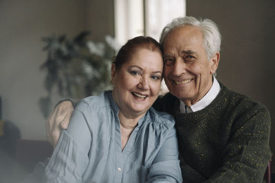 Portrait of happy senior couple at home