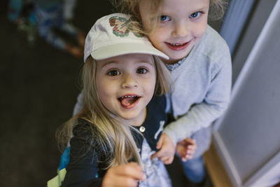 Smiling girls looking at camera