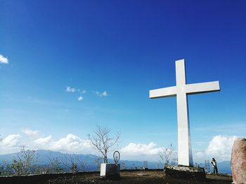 Cross against sky