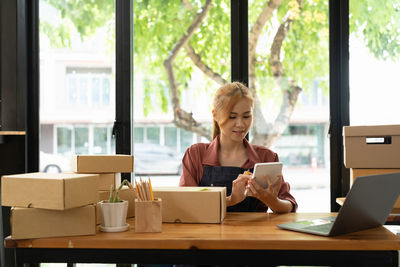 Young woman using laptop at home