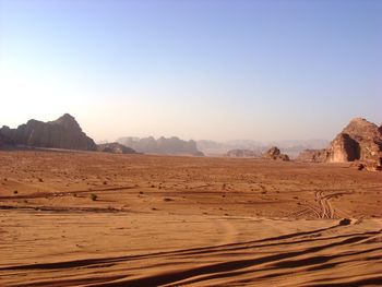 Scenic view of desert against clear sky