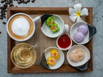 Dim sum menu set served with dipping sauce tea and coffee set