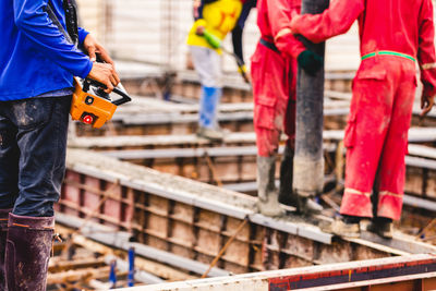 Low section of people working at construction site