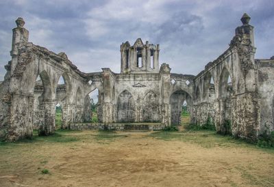 View of historical building against cloudy sky