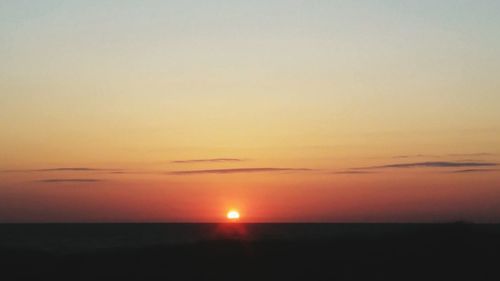 Scenic view of sunset over sea