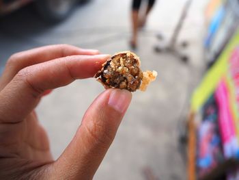 Close-up of hand holding ice cream