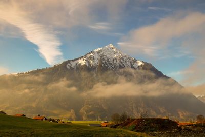 Panoramic view of landscape against cloudy sky