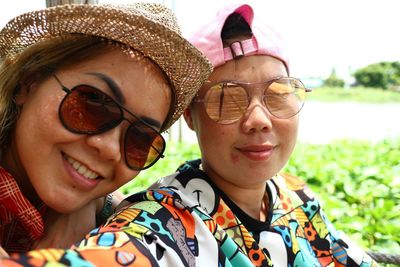 Portrait of smiling women wearing sunglasses