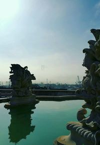 Fountain in park against sky