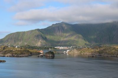 Scenic view of lake and mountains against sky