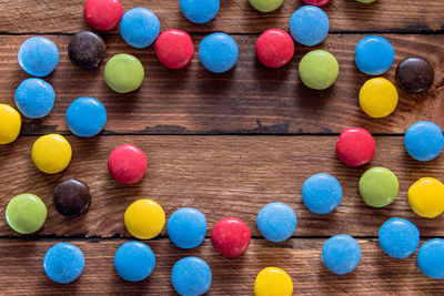 High angle view of multi colored candies on table