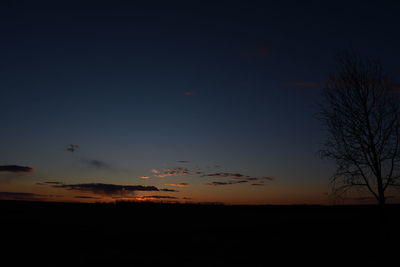 Scenic view of silhouette landscape against sky at sunset