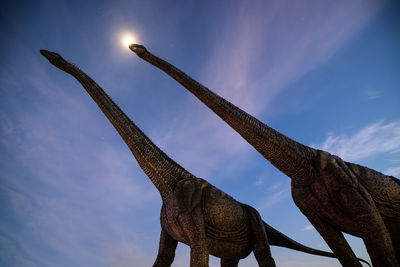 Low angle view of statue against sky