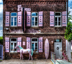 Horses on window of building