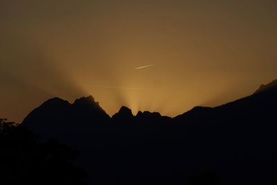 Low angle view of silhouette mountain against sky during sunset