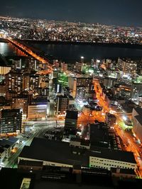 High angle view of illuminated buildings in city at night