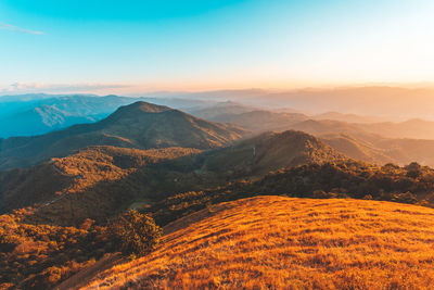 Scenic view of mountains against sky during sunset