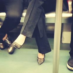 Low section of woman in high heels