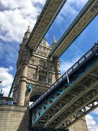 Low angle view of bridge against sky in city