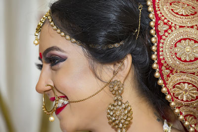 Close-up of smiling bride looking away