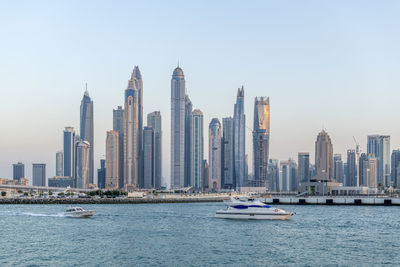 Amazing dubai marina and famous jumeirah beach at sunset, united arab emirates