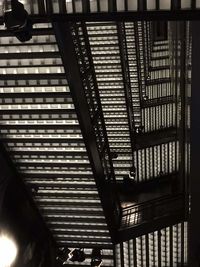 High angle view of people walking on staircase in building