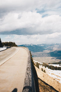 Road by sea against sky