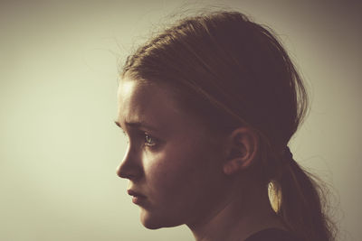 Close-up portrait of a girl looking away