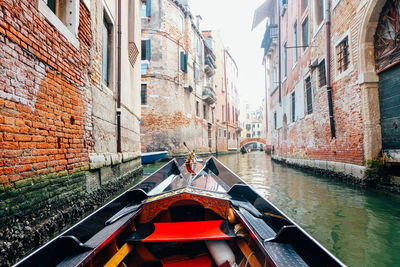 Canal amidst buildings in city