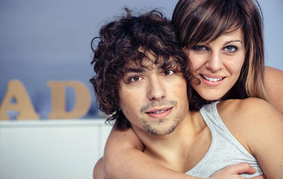 Portrait of loving couple relaxing on bed