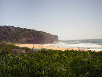 Scenic view of beach against clear sky