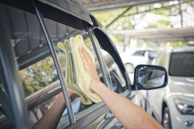 A wipe clean the car with cloth and polishing waxing cream