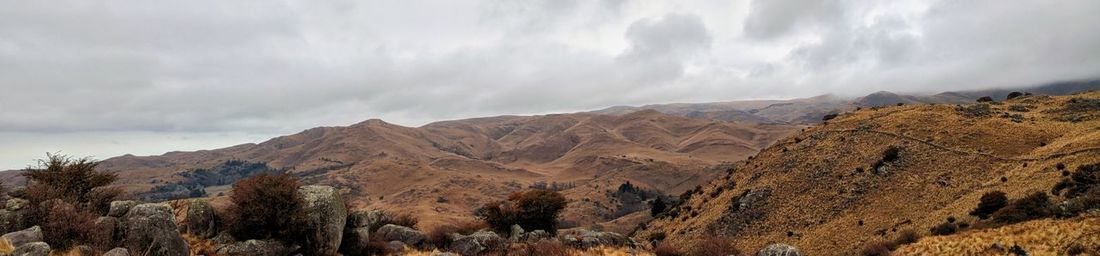 Panoramic view of landscape and mountains against sky
