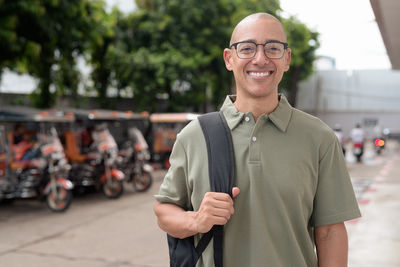 Portrait of young man standing outdoors