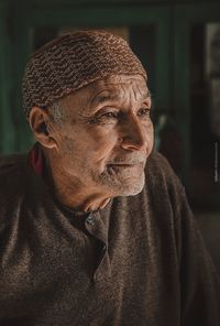 Close-up portrait of man wearing hat