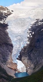 Scenic view of snow covered mountains