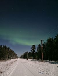 Road against sky at night