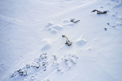 Excavators in mountainous area in winter