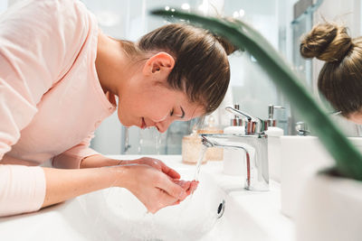 Boy washing hands