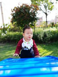 Close-up of cute boy playing in grass