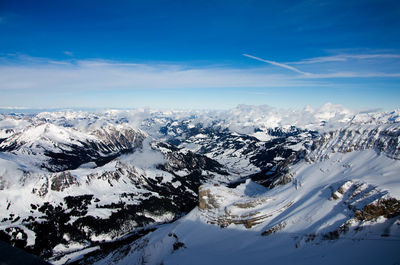 Scenic view of snowcapped mountains against sky