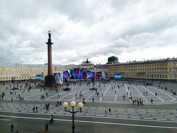 People in city against sky